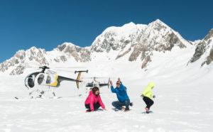 helicopter scenic flight snow landing on nz mountain